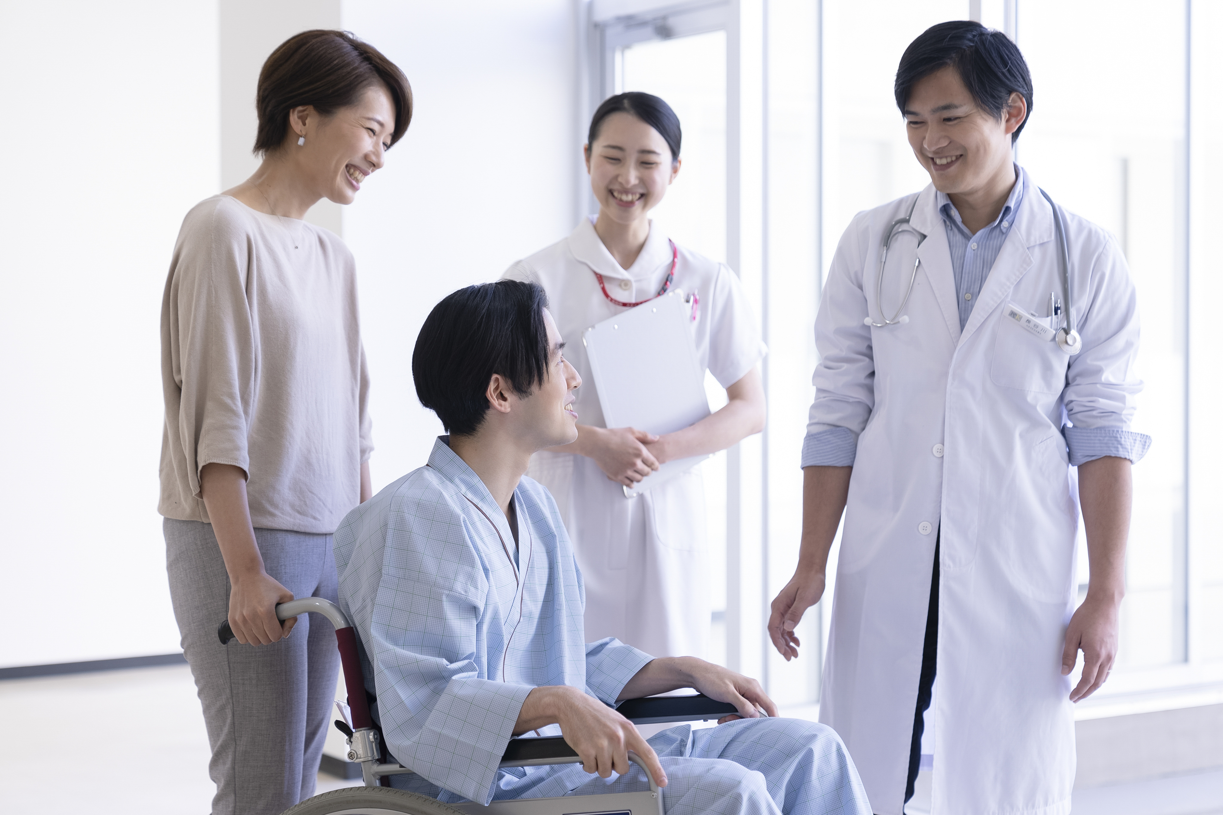 Healthcare team assisting a patient